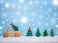 Wooden toy car and Christmas tree with shiny light for Christmas and New Year holidays background, Winter season, falling snow, Royalty Free Stock Photo