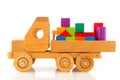 Wooden toy car with colorful blocks Royalty Free Stock Photo