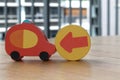 Wooden toy cars with arrow on the circle on the table. Royalty Free Stock Photo