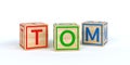 wooden toy cubes with letters with name tom