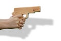 Wooden toy gun in child's hand