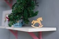 Wooden toy horse made of plywood is on the shelf Royalty Free Stock Photo