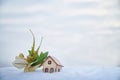 Wooden toy house on snow, natural abstract background. winter season concept. Christmas and new year holidays. symbol of Royalty Free Stock Photo