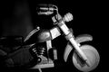 Wooden toy motorcycle on a dark background Royalty Free Stock Photo