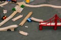 Wooden toy railway. Designer blocks are scattered on the floor. Educational games for children