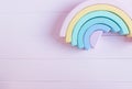 Wooden toy rainbow, blocks, pastel color arc on pink background. Natural no plastic toys for creativity development. Flat lay, Royalty Free Stock Photo