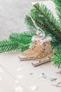 Wooden toy skates on a white wooden background with christmas tree Royalty Free Stock Photo