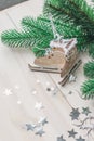 Wooden toy skates on a white wooden background with christmas tree Royalty Free Stock Photo