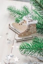 Wooden toy skates on a white wooden background with christmas tree Royalty Free Stock Photo