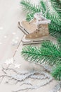 Wooden toy skates on a white wooden background with christmas tree Royalty Free Stock Photo