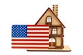 Wooden toy symbolic house and USA flag on white isolated background Royalty Free Stock Photo