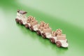 Wooden toy train cardboard boxes on a green background 3D illustration