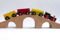 Wooden toy train crossing track bridge. Copy space concept Royalty Free Stock Photo