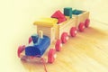 Wooden toy train over wooden floor Royalty Free Stock Photo