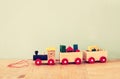 Wooden toy train over wooden table Royalty Free Stock Photo