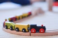 Wooden toy train on the tracks Royalty Free Stock Photo