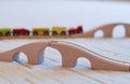 Wooden toy train on the tracks and empty brige in front Royalty Free Stock Photo