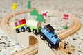 Wooden toy train on wood tracks Royalty Free Stock Photo