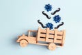 Wooden toy truck with mustache and bows in the back on blue background. Happy Fathers day concept Royalty Free Stock Photo