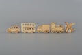 Wooden toy vehicles isolated on a grey background. concept for childhood development, minimalist nostalgic toys and educational Royalty Free Stock Photo