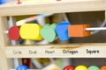 Wooden toys to learn and play with shapes and color selective f Royalty Free Stock Photo