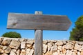 Wooden track blank road sign in Mediterranean Balearic