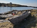 Wooden traditional Norwegian boat on the fjord coast Royalty Free Stock Photo