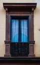 Wooden traditional window in Spain wit stucco decoration Royalty Free Stock Photo