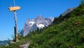 Wooden trail marker with copy space in the Swiss Alps Royalty Free Stock Photo