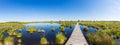 Wooden trail over a bog lake at Hohes Venn panorama Royalty Free Stock Photo