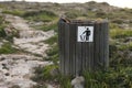 Wooden trash or litter bin with for bottle, beer can and organic waste visibile showing pollution in coastal areas near the sea Royalty Free Stock Photo