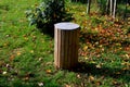 wooden trash park trash can. lined with wood. panelling.