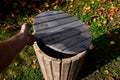 wooden trash park trash can. lined with wood. panelling. cylindrical