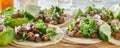 Wooden tray with carne asada tacos on corn tortilla Royalty Free Stock Photo