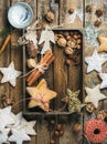 Wooden tray with cookies, decorative angels and stars, cinnamon, nuts Royalty Free Stock Photo