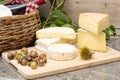 Wooden tray with different french cheeses Royalty Free Stock Photo