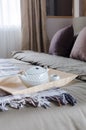 Wooden tray of green tea set on bed in modern bedroom Royalty Free Stock Photo