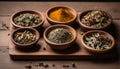 A wooden tray holds four bowls of spices, including cinnamon, ginger, and cloves