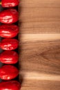 Wooden tray with hot peppers on a side Royalty Free Stock Photo