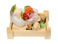 Sashimi set with raw fresh scallops, sea bass, tuna, salmon, cucumber, rice noodles on a wooden tray Royalty Free Stock Photo