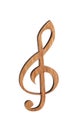 Wooden treble clef on white background.