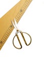 Wooden triangle ruler and scissors on a white background Royalty Free Stock Photo