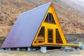 Wooden triangular house built in the mountains