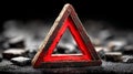 Wooden triangular warning sign with red border on a dark surface Royalty Free Stock Photo