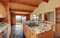 Wooden trim home with open floor plan. Kitchen with granite counter top. Royalty Free Stock Photo