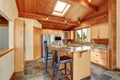 Wooden trim home with open floor plan. Kitchen with granite counter top. Royalty Free Stock Photo