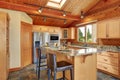 Wooden trim home with open floor plan. Kitchen with granite counter top. Royalty Free Stock Photo