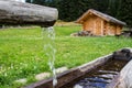 Wooden trough with spring water in a farmhouse Royalty Free Stock Photo