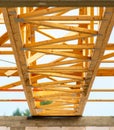 Wooden Truss Framework on New Construction Project Under Bright Sky with Modern Architectural Design Elements Royalty Free Stock Photo