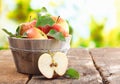 Wooden tub full and a halved fresh apple Royalty Free Stock Photo